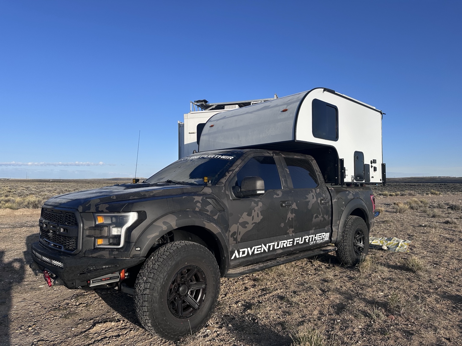 Ford Raptor with Suntrek truck camper in the desert